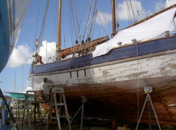 Noel sanding the topsides ready for a new coat