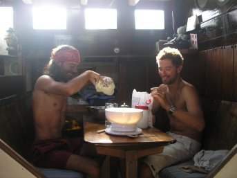 Cesar and Bernardo cooking pizza