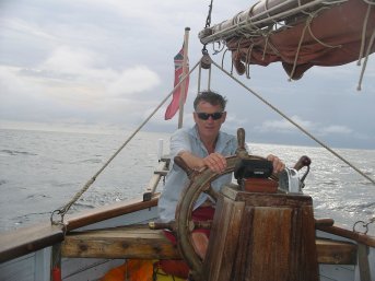 Robin at the wheel under overcast sky