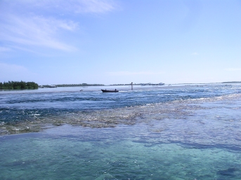 Local boat zooming through the pass