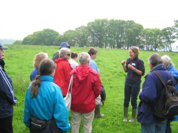 Katharine leading a group through farmland